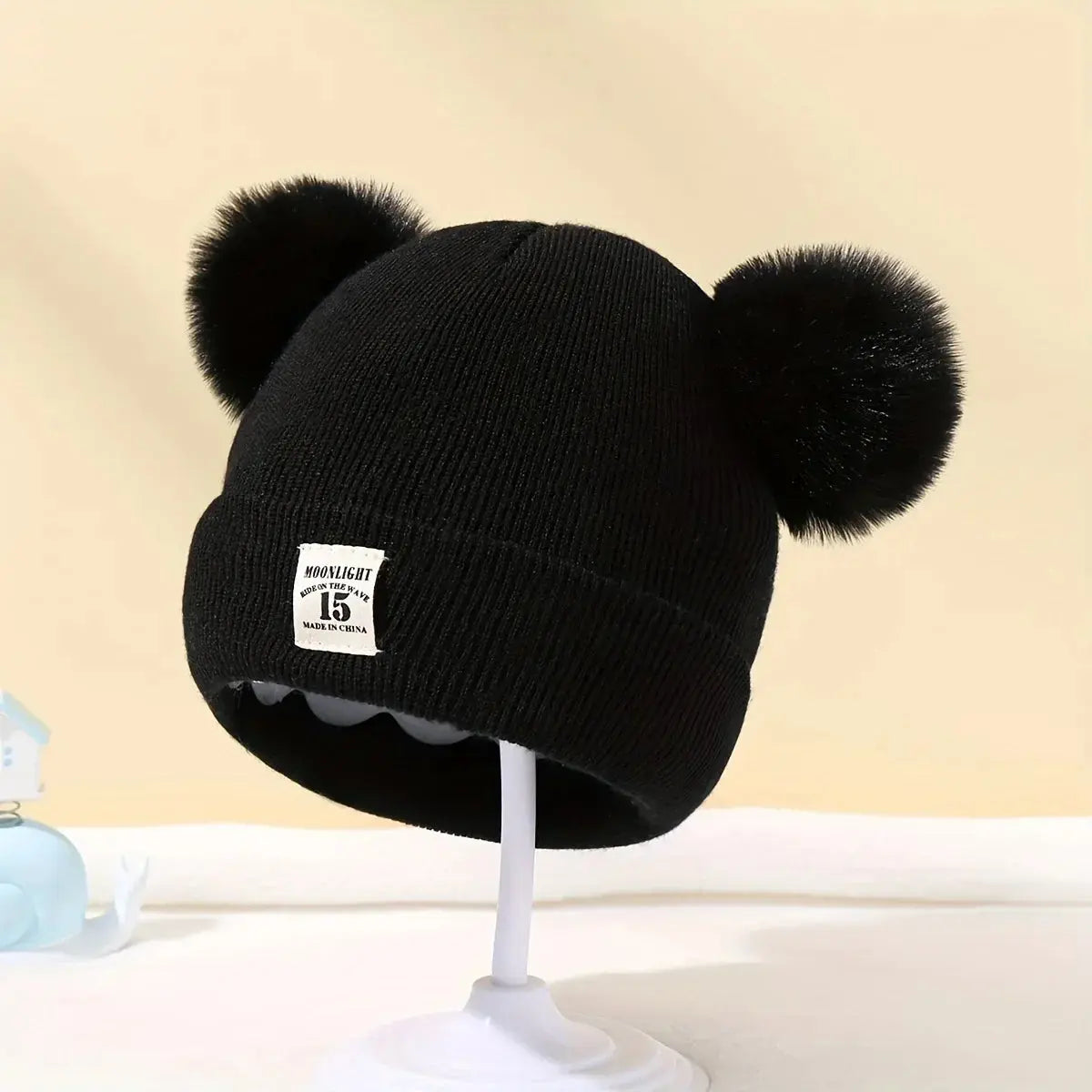 Bonnet à pompons pour bébé - Monde à maman