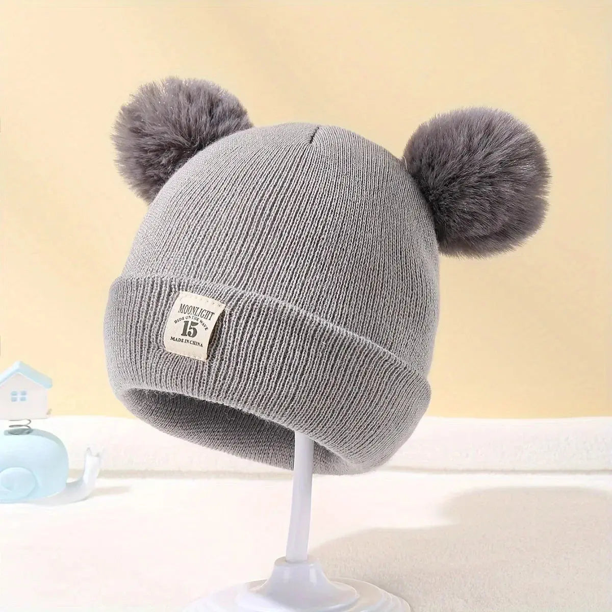 bonnet à pompons pour bébé - Monde à maman