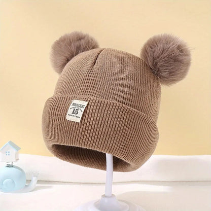 Bonnet à pompons pour bébé - Monde à maman